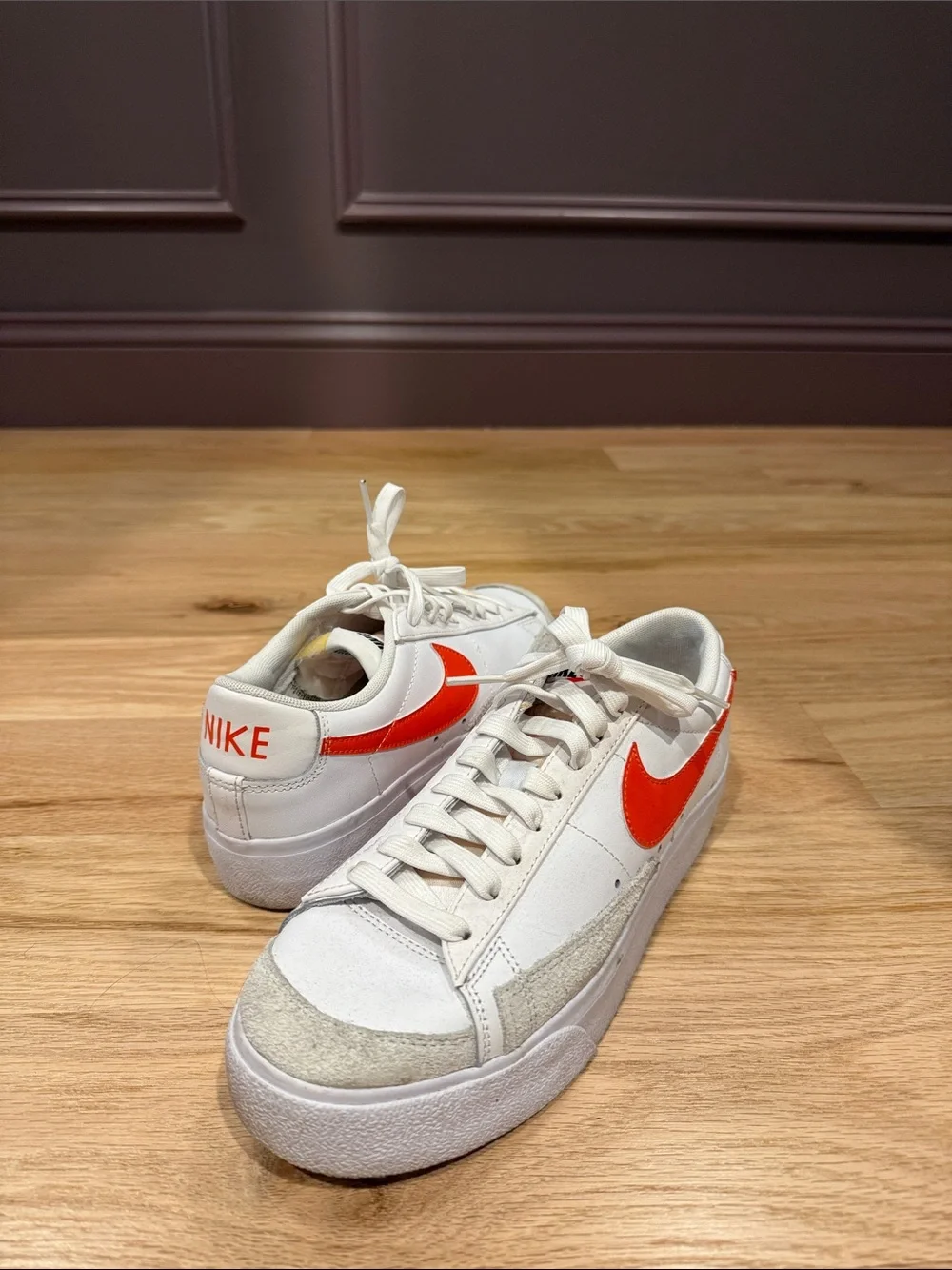 Nike Men’s White Sneakers with Orange-Red Swoosh